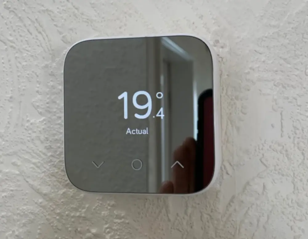 Smart thermostat showing room temperature